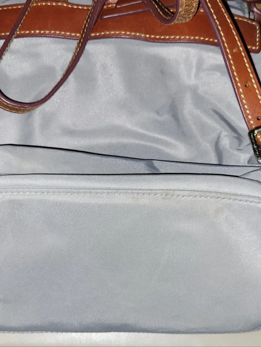 Dooney & Bourke Light Gray Nylon Backpack with Brown Leather Trim.